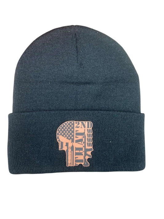 A black leather patch beanie engraved with "2nd That" wording overlaid with a flag, a machine gun and ammo, all set on a white background.