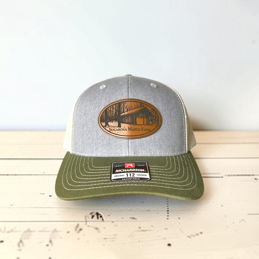 Richardson 112 trucker hat with a sample engraved leatherette logo patch