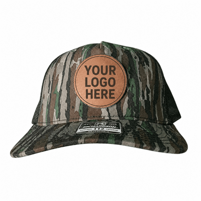 Camo Richardson 112 trucker hat with a custom engraved leatherette logo patch