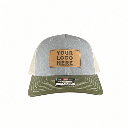 Gray and olive Richardson 112 trucker hat with a tan Your Logo Here leatherette patch