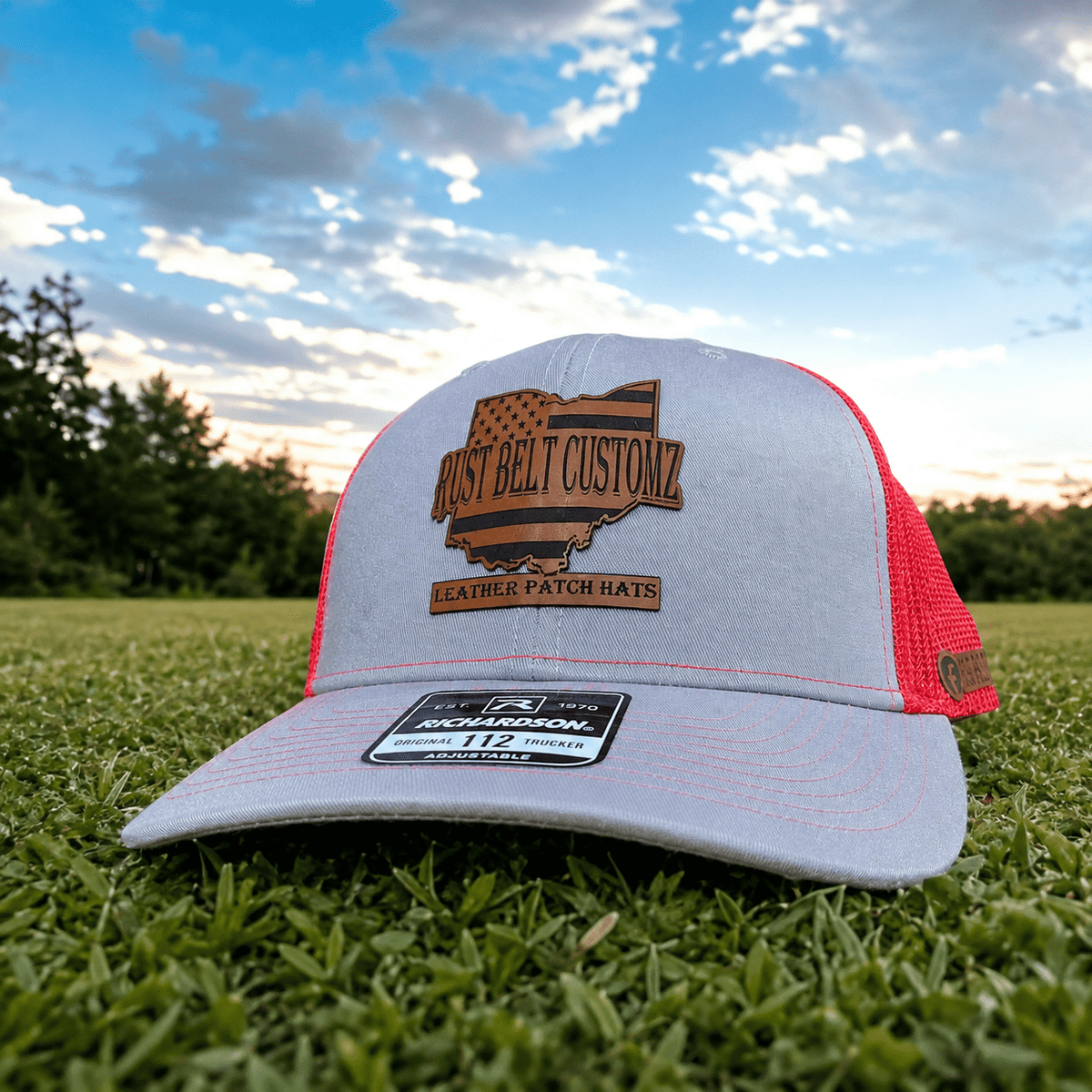 Richardson 112 hat with a Rust Belt Customz engraved leatherette patch photographed outdoors
