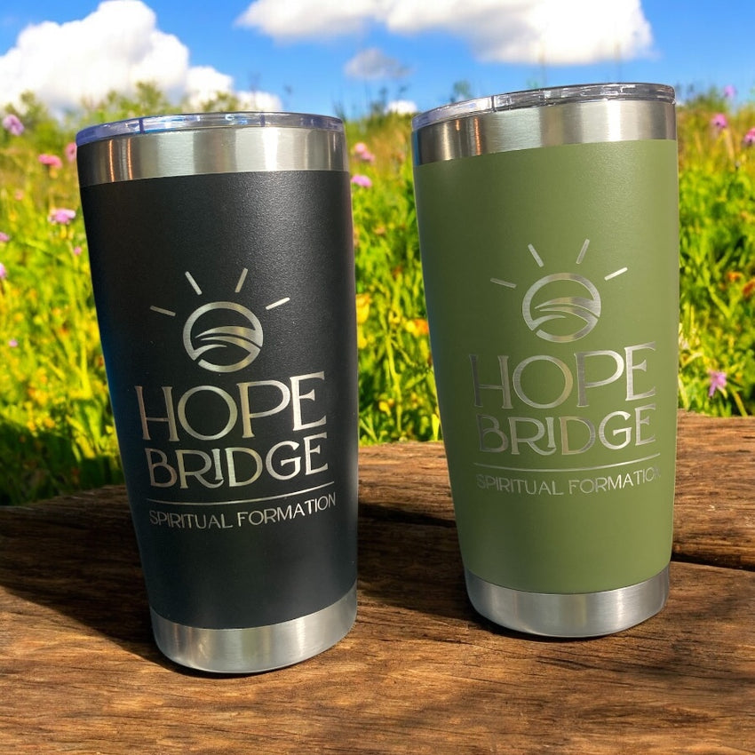 Black and olive stainless steel tumblers engraved with the Hope Bridge logo